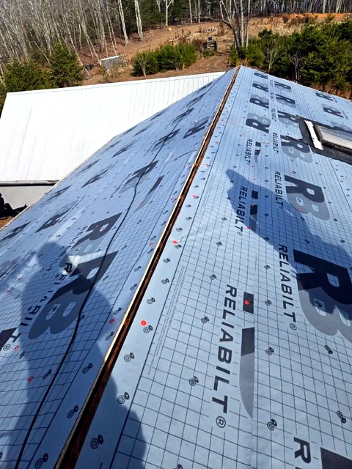 Roof fully covered in new synthetic underlayment along the ridge, Kings Mountain NC